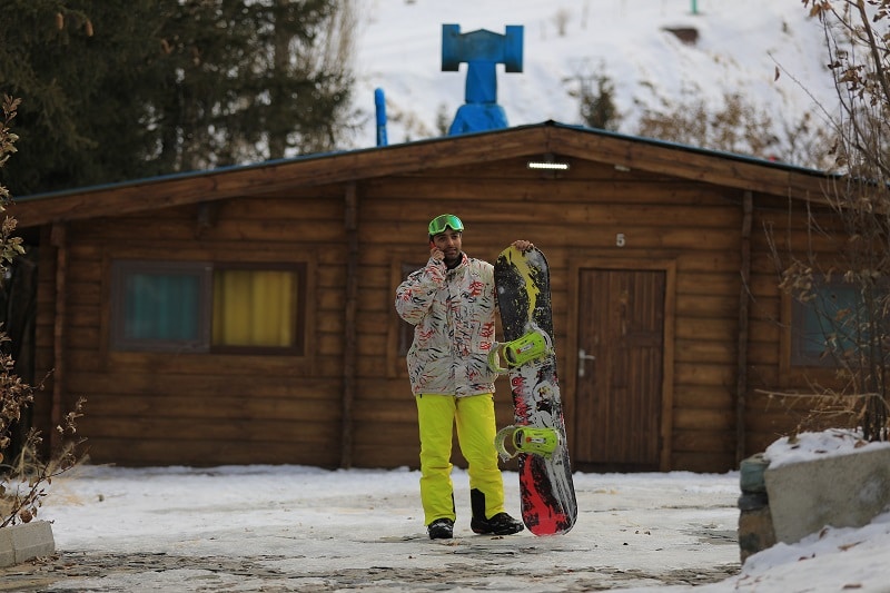 man with snowboard