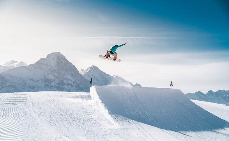 snowboarding jump in snow park